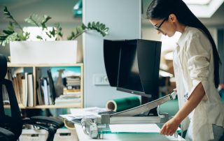 Female digital designer looking at swatches at an office